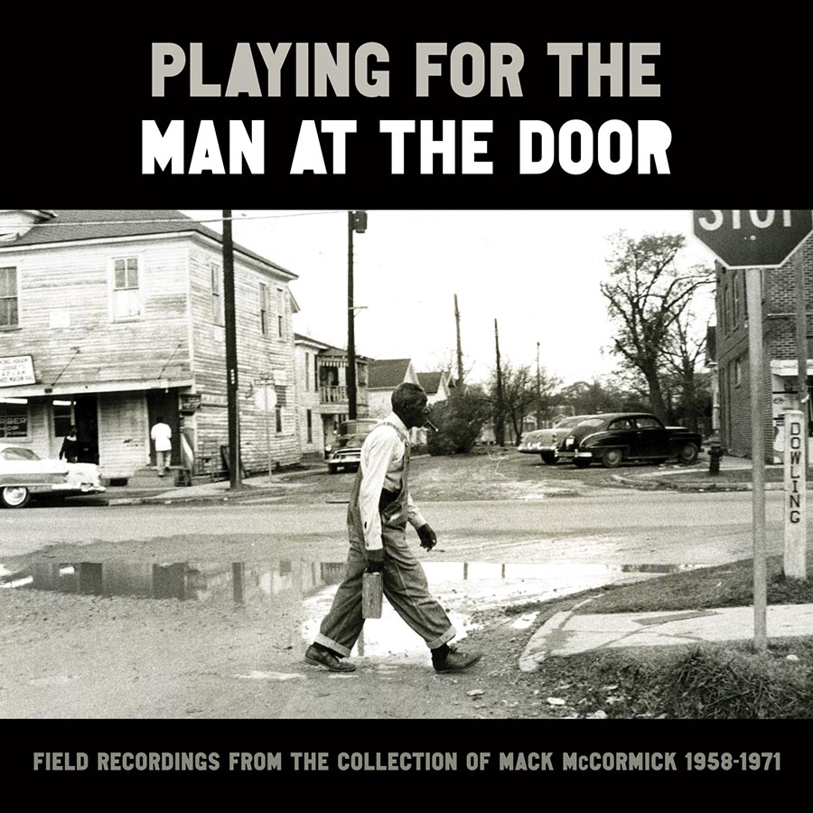 Album cover with black-and-white photo of a Black man crossing a dirt road.
