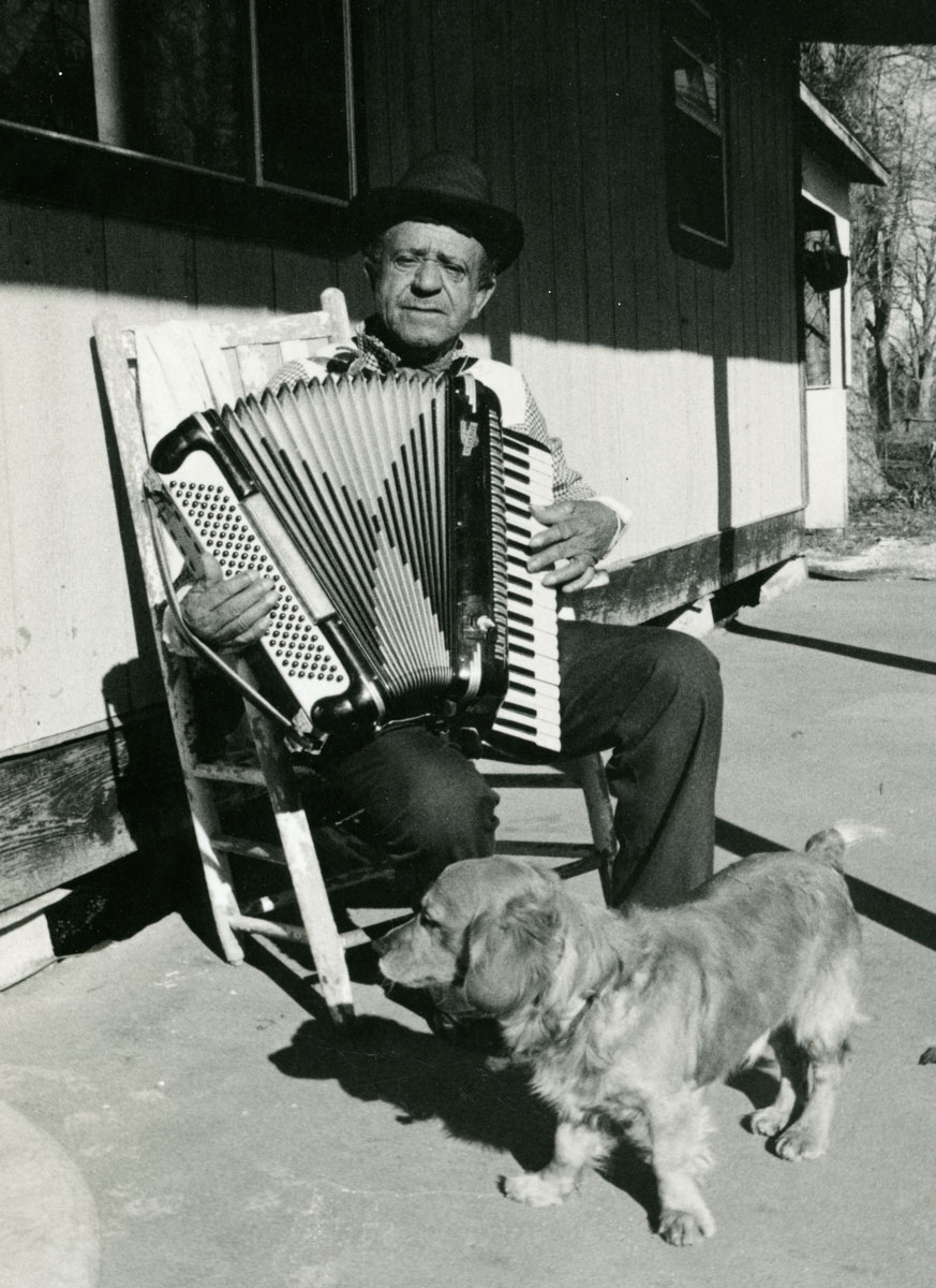 Ambrose Sam with accordion and cocker spaniel