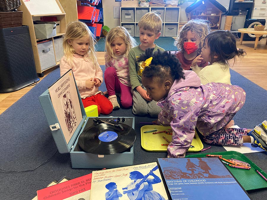 Elementary school children exploring Folkways records in the classroom. Photo by Greg Gardner.