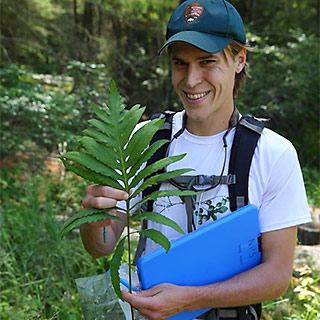 Doug Manning, biologist for the New River Gorge National River, shows a plant sample he collected. One of Manning’s duties is regularly monitoring plant populations in order to check whether they are doing well. Photo courtesy of Doug Manning